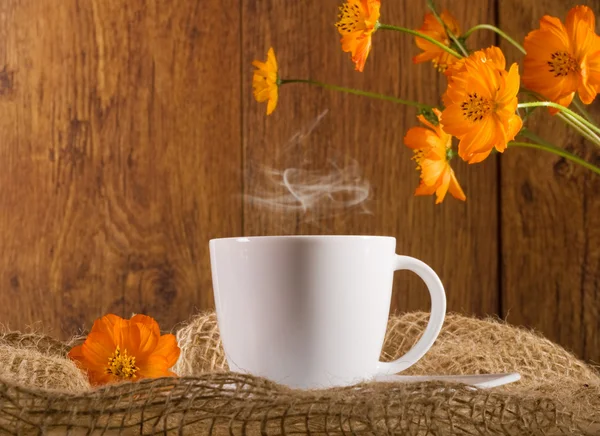 Coffee with orange flowers — Stock Photo, Image