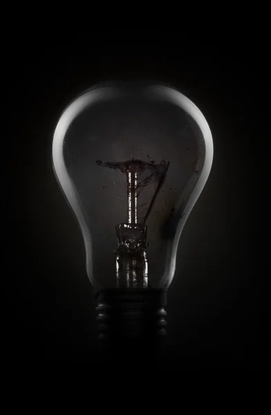 Light bulb in dark — Stock Photo, Image