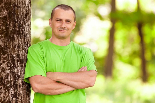 Young man in the forest — Stock Photo, Image