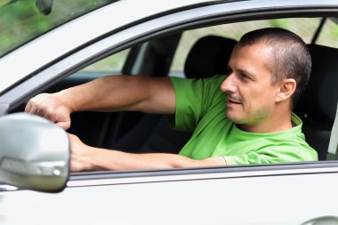 Young man driving fast clipart