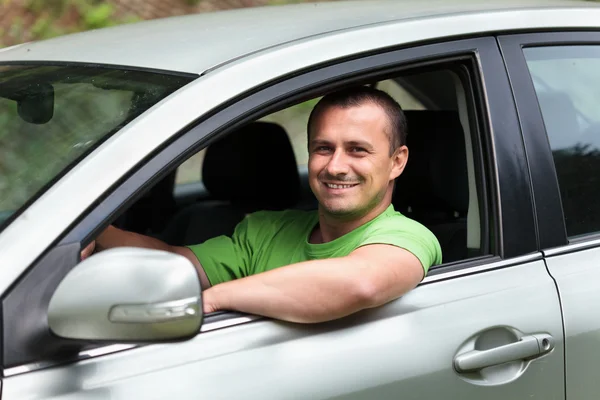 Šťastný mladý muž s novým vozem Stock Obrázky