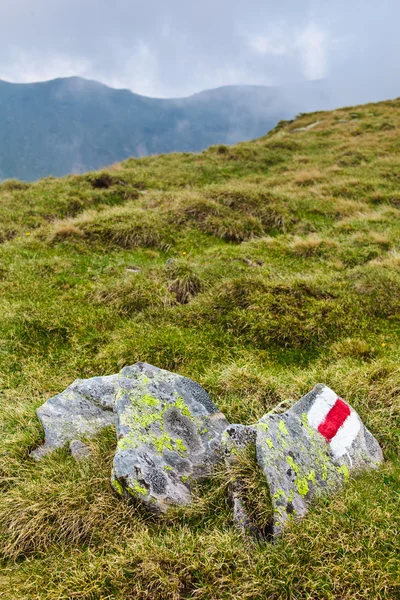 Trail mark on a rock in mountains — Stock Photo, Image