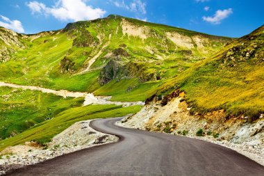 Transalpina winding road in Romania clipart