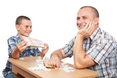 Father and son playing rummy clipart