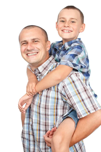 Отец и сын на спине — стоковое фото