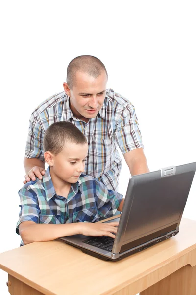 Otec a syn u počítače Stock Snímky