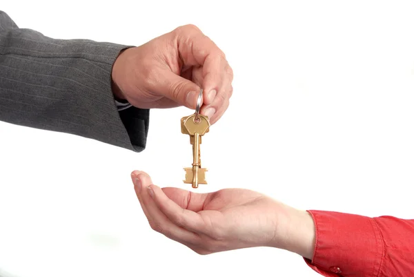 Бізнесмен передає ключ до руки жінки — стокове фото