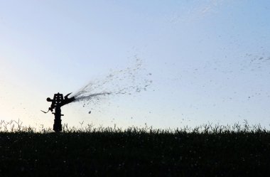 Lawn sprinkler silhouette clipart