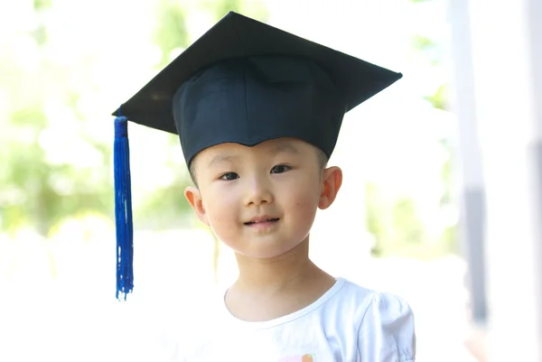 Baby with gown hat — Stock Photo, Image