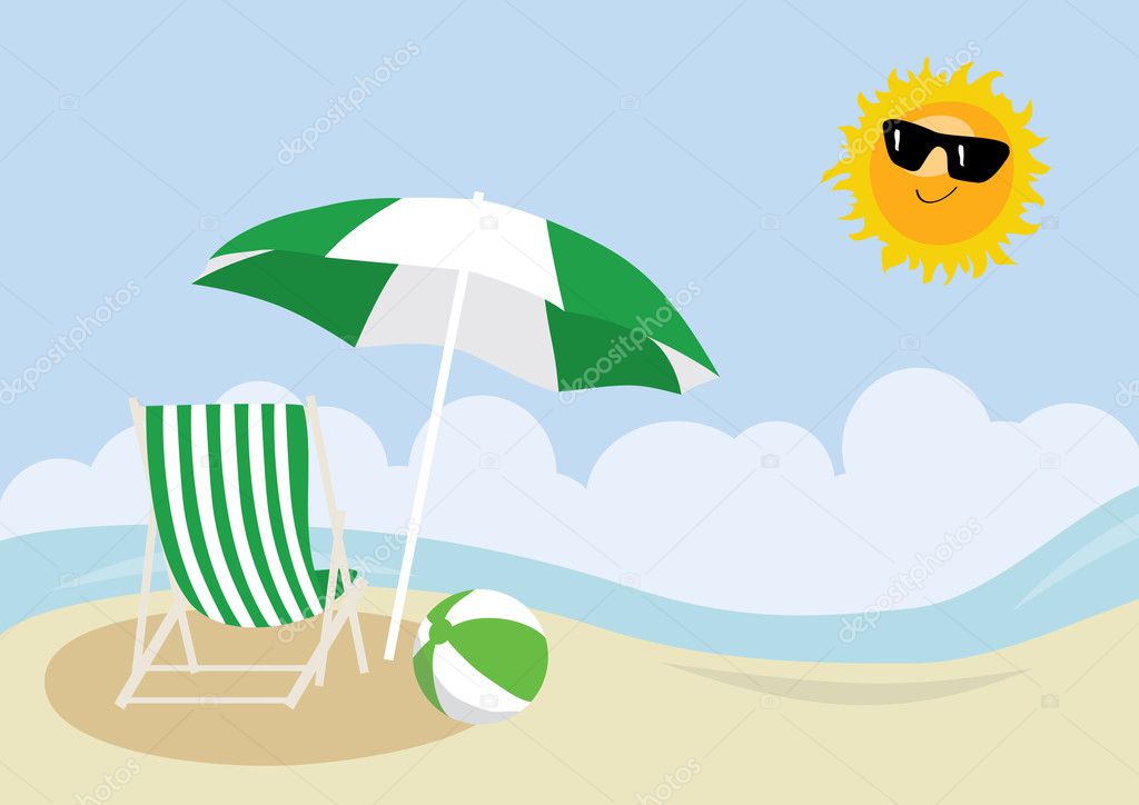 Deck chair, beach ball and umbrella on a beach