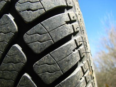 Close-up of a tire with sky background clipart