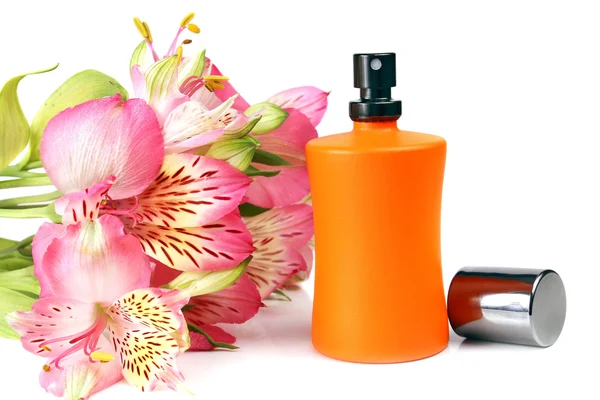 Small bottle with a perfume liquid and flowers — Stock Photo, Image