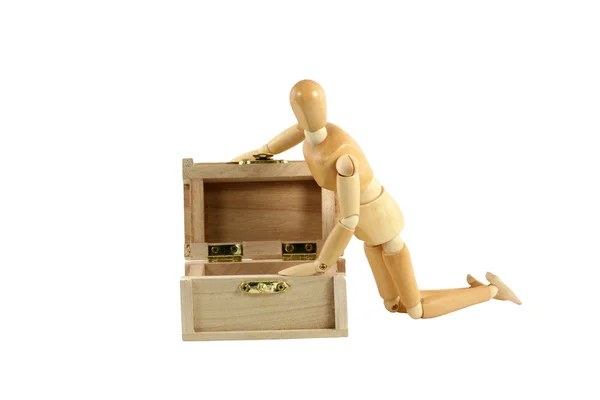 Wooden manikin opening treasure chest Royalty Free Stock Images
