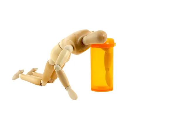 stock image Manikin reaching in pill bottle