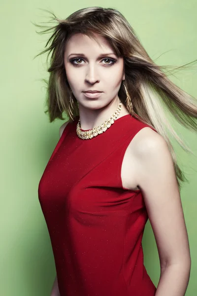 Portrait of the blonde woman in a red dress — Stok fotoğraf