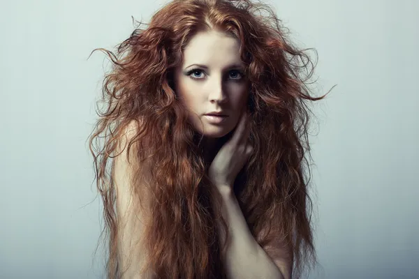 Fashion portrait of a young beautiful redheaded woman — Stock Photo, Image