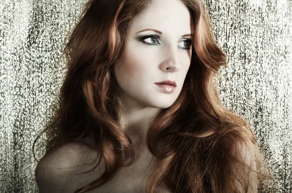 Fashion portrait of a young beautiful redheaded woman — Stock Photo, Image