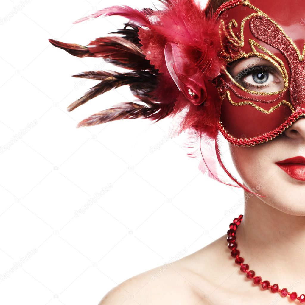 The beautiful young woman in a red venetian mask