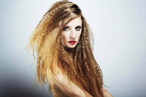 Fashion portrait of a young beautiful redhead woman — Stock Photo, Image