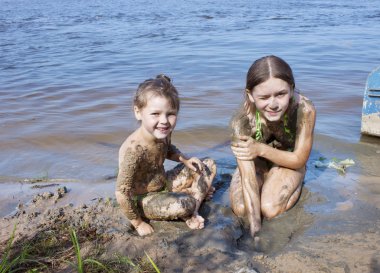 Children in the mud on the river clipart