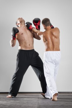 Two men fighting clipart