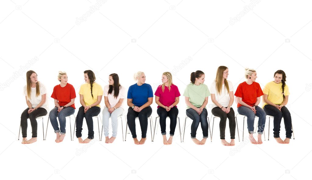 Group of women on chairs in a line