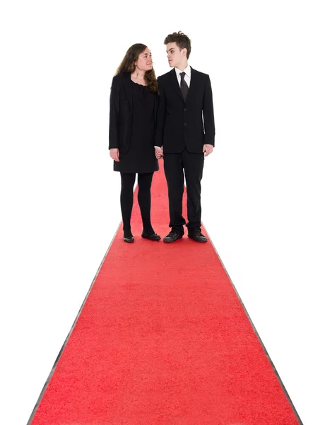 Couple standing on a red carpet — Stock Photo, Image