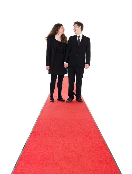 Couple standing on a red carpet — Stock Photo, Image