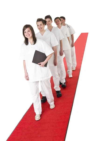 Ärzteteam auf rotem Teppich — Stockfoto