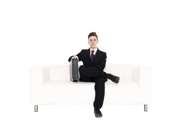Uomo d'affari seduto in un divano — Foto Stock