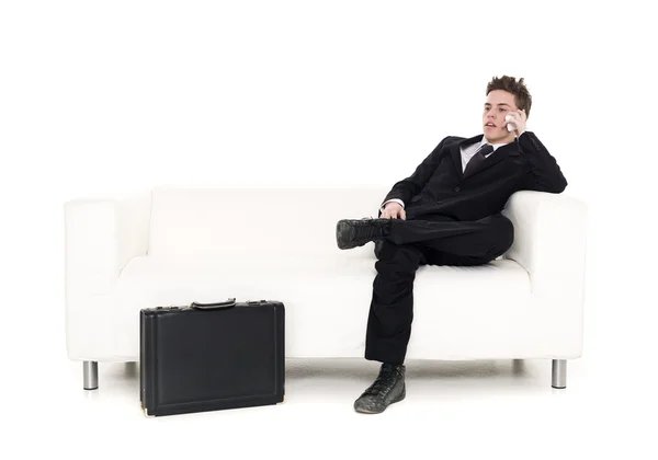 Empresário sentado em um sofá — Fotografia de Stock