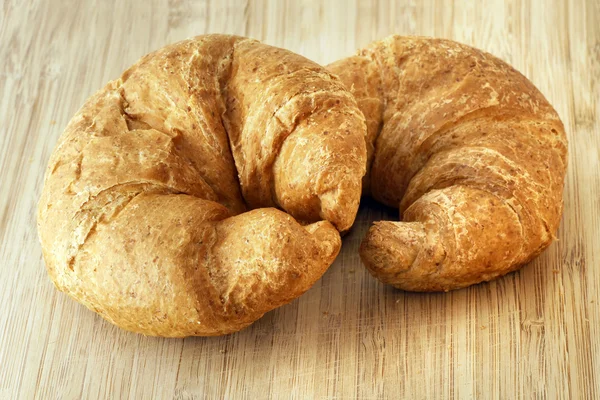 Two whole wheat croissants — Stock Photo, Image