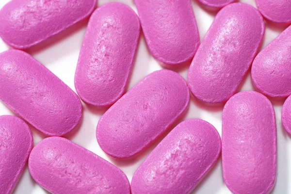 Рожеві таблетки макросу — стокове фото