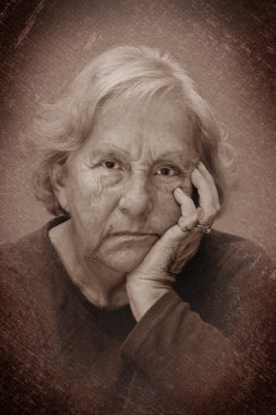 Dramatic senior woman sulking portrait clipart