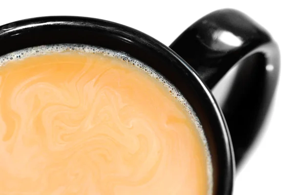 Coffee and cream in black mug — Stock Photo, Image