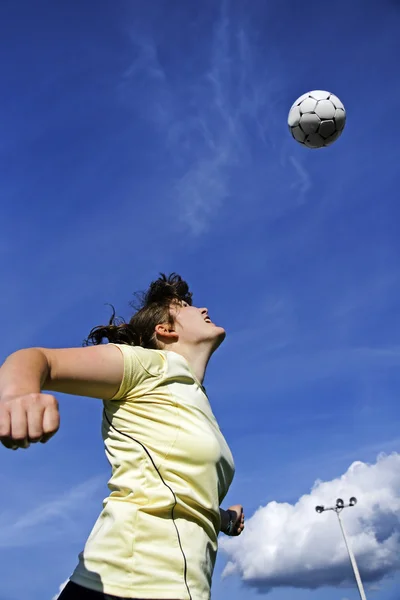 stock image Woman soccer or football player header