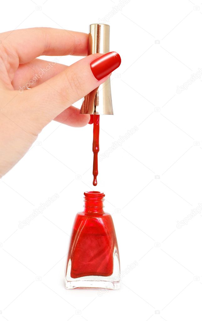 Female hand holding nail brush