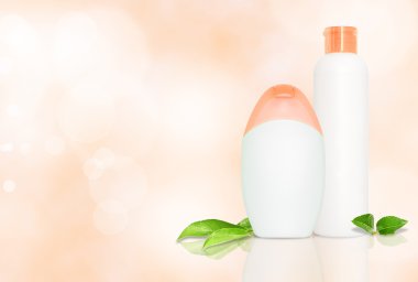 Two blank cosmetics bottles with copyspace clipart