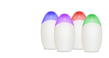 Four blank cosmetics bottles with copyspace clipart