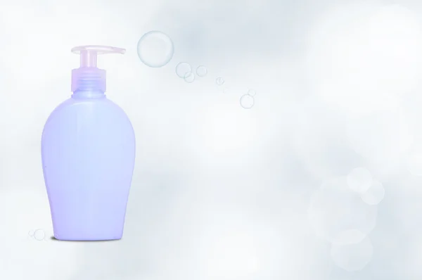 Distributore di sapone blu con bolle — Foto Stock