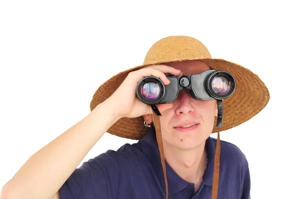 Young man with binoculars and straw hat — Stock Photo, Image