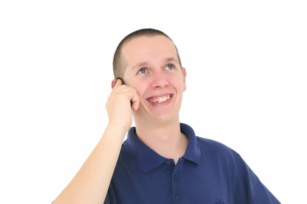 Młody człowiek uśmiechający się rozmawia przez telefon — Zdjęcie stockowe