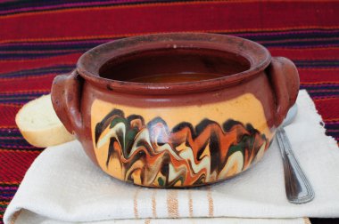 Traditional dish served in clay pot clipart