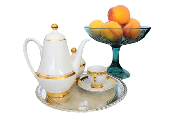 Coffee set on silver tray and bowl of appricots — Stock Photo, Image