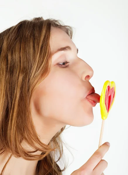 Teenager girl licking lollipop — Stock Photo, Image