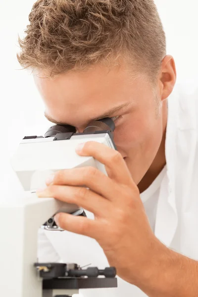 Smiling researcher with microsope — Stock Photo, Image