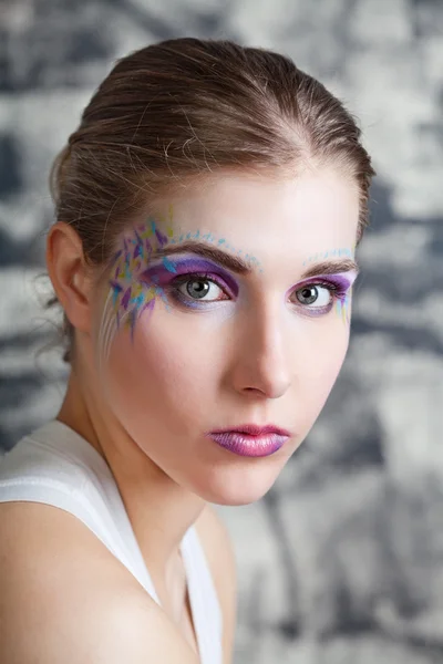 Young woman with face art — Stock Photo, Image