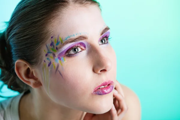 stock image Portrait of young woman with face art