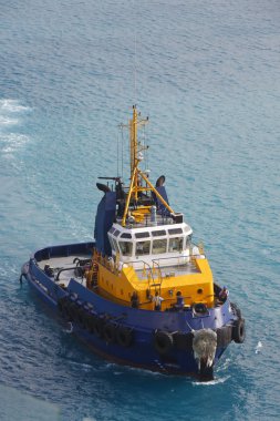 Yellow and Blue Tugboat in Aqua Water clipart