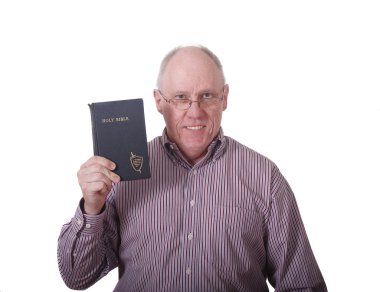 Older Man in Striped Shirt Holding Old Battered Bible clipart